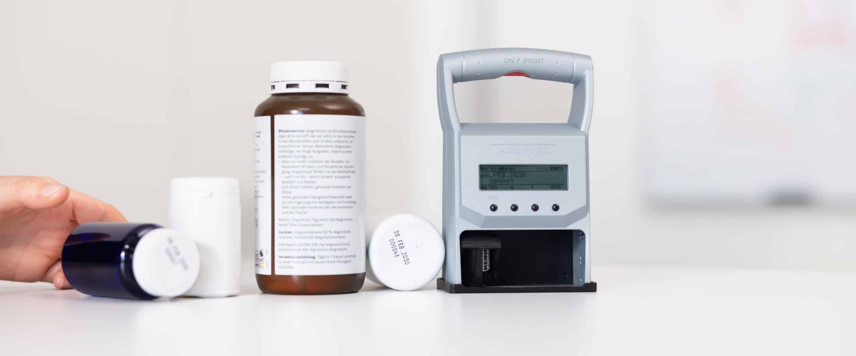 The REINER jetStamp graphic 970 marks medication containers directly with the date and lot number.