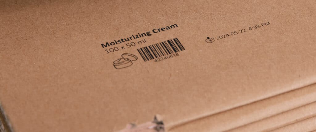 Cardboard packaging with barcode and date marking