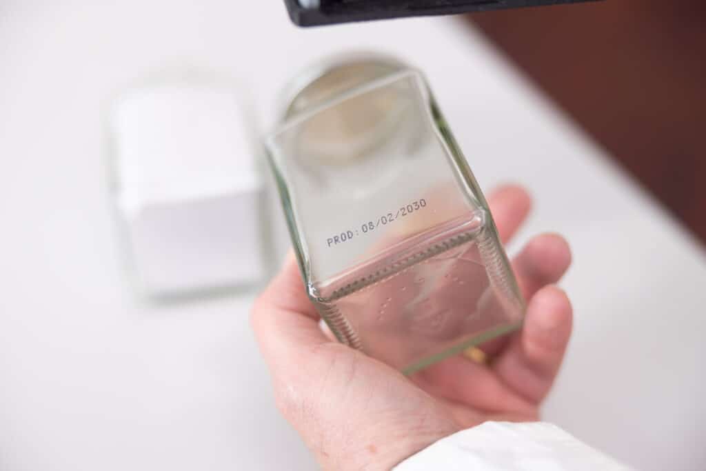 Marking printed directly on glass container without label