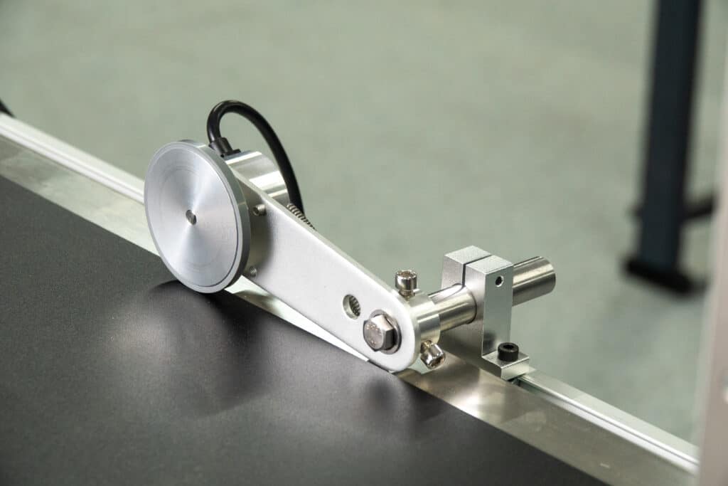REINER encoder as an accessory for jetAxis, mounted on a conveyor belt.