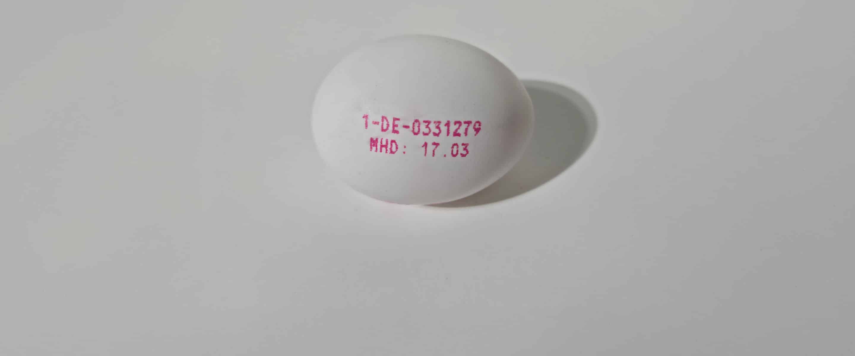 Egg with pink origin and best-before date code